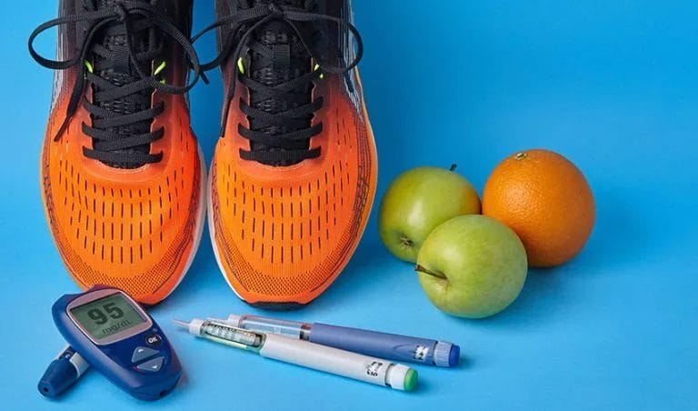 Decorative image of orange running shoes and health objects on blue background.