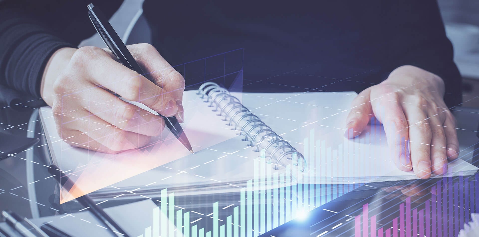 A hologram of a Forex chart imposed over a trader using his paper day trading journal.
