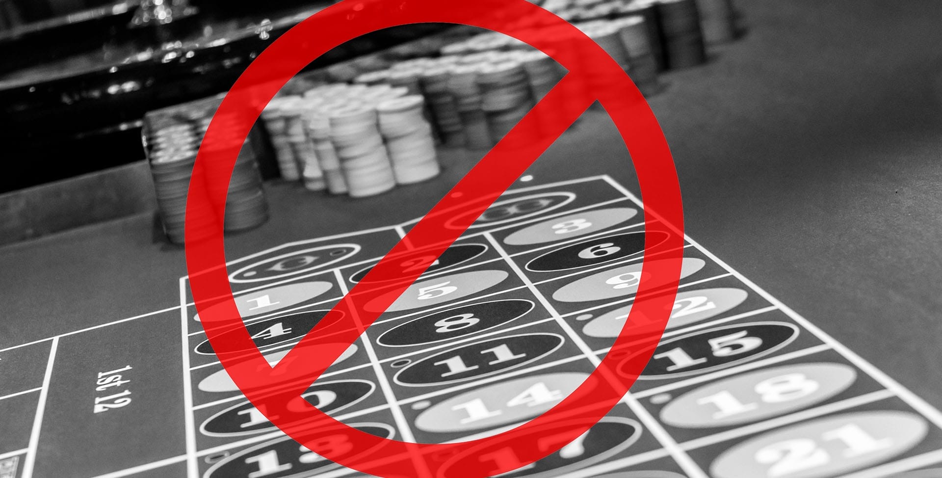 A roulette wheel and table with a “No” symbol superimposed over it.